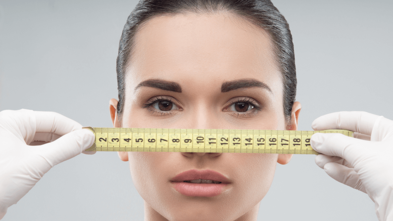 Measuring tape in front of woman's head