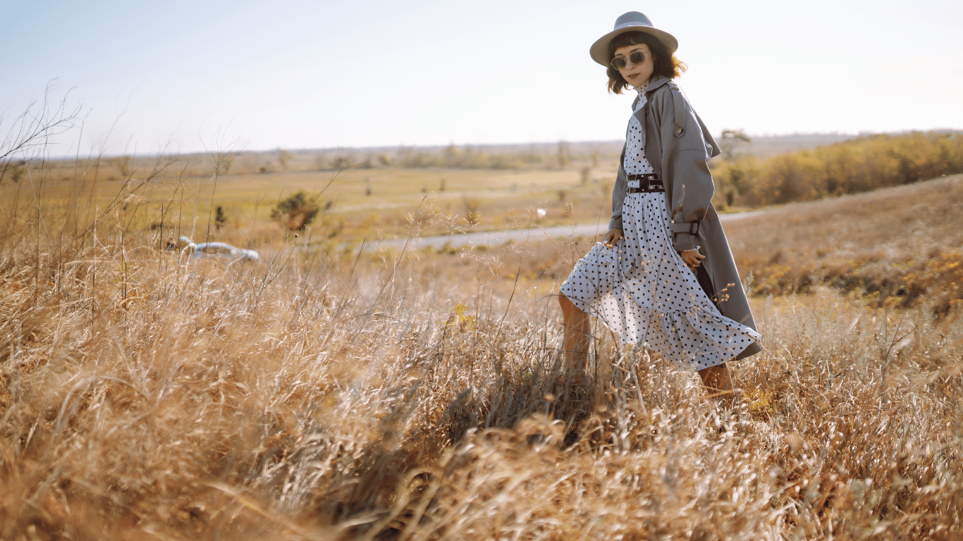 stylish woman in hat and coat in autumn