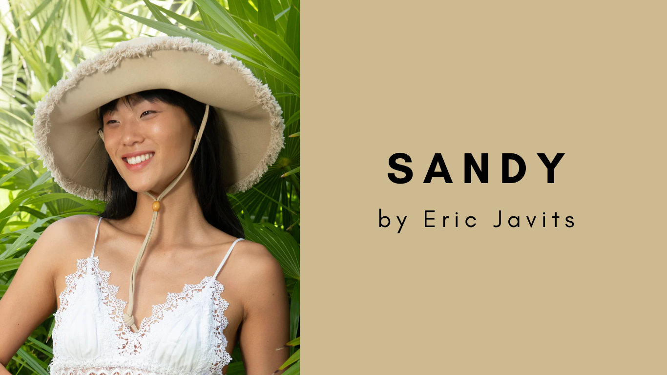 A woman wearing a stylish wide brim sun hat
