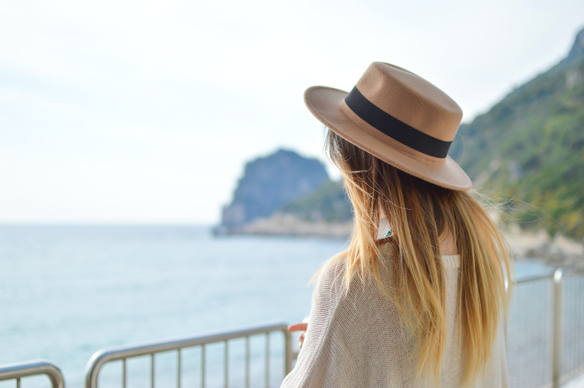 woman wearing fedora hat on a holiday