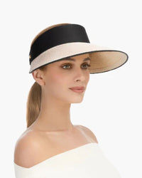 Woman wearing a wide-brimmed visor hat with a sleek ponytail., visirs, visor hats