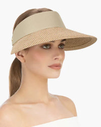 Woman wearing a wide-brimmed sun visor hat., visirs, visor hat